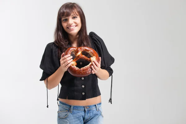 Bavarian girl with pretzel — Stock Photo, Image