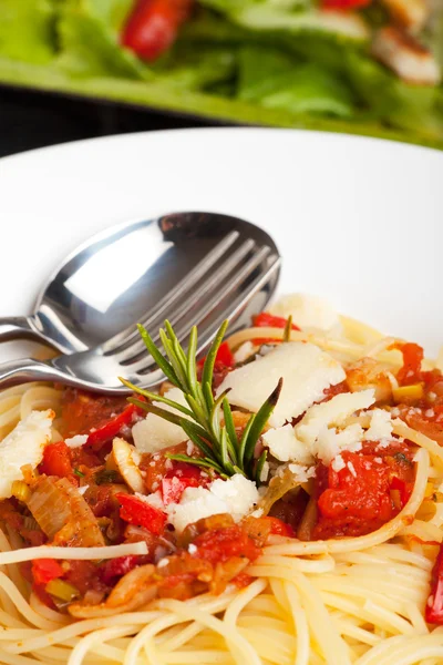 Detail of a rosemary leaf on spaghetti — Stock Photo, Image