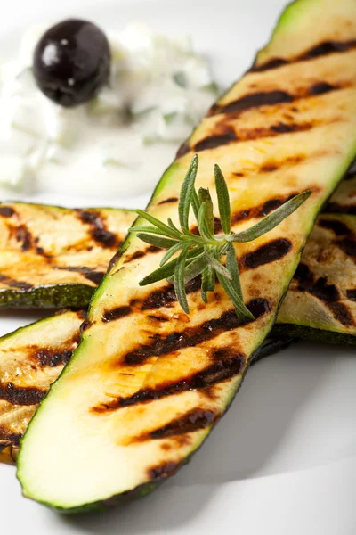 Grilled zucchini with a rosemary leaf — Stock Photo, Image