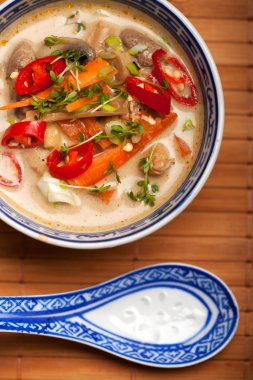 Tom kha gai soup with chicken and chili clipart