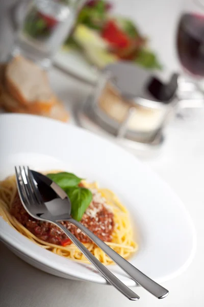 stock image Plate with spaghetti bolognese and basil leaf