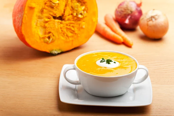 Pumpkin soup in a white bowl — Stock Photo, Image