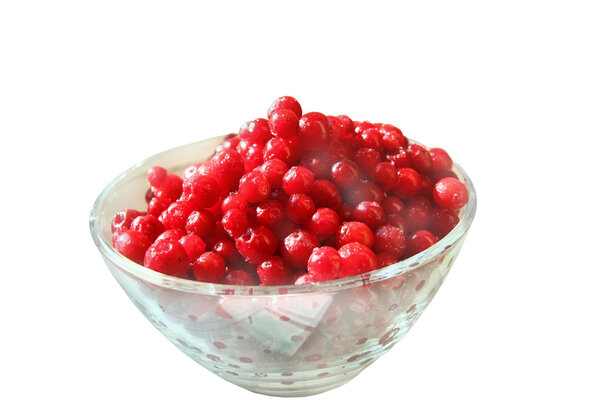 Cowberries into a glass plate isolated