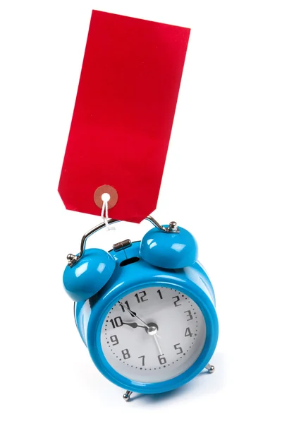 Reloj Despertador Azul Con Una Etiqueta Equipaje Rojo Blanco Pegado — Foto de Stock