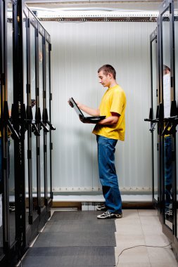 The engineer stand in datacenter clipart