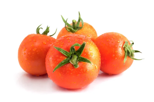 Quattro pomodori con gocce d'acqua — Foto Stock