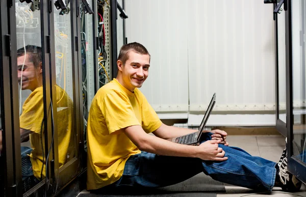 Engineer Sits Datacenter Configuring Equipment — Stock Photo, Image