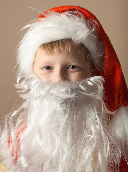 Little boy in Santa Claus suit with beard — Stock Photo, Image