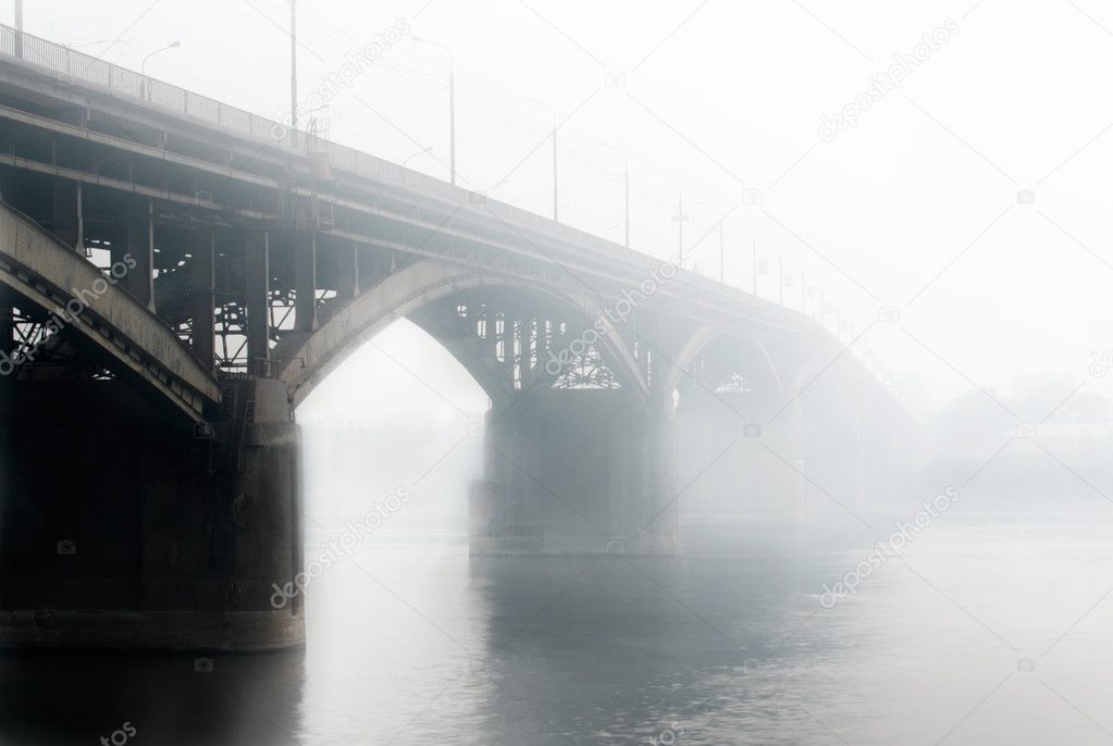 Way to anywhere. Bridge with out car in fog.