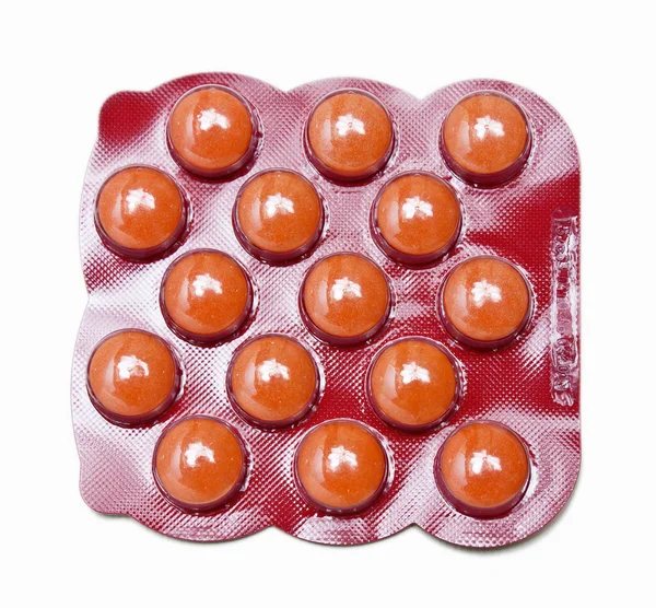 stock image Pack of orange medicine pills isolated on white background