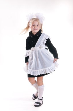 Young schoolgirl in studio clipart