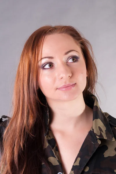 stock image Closeup portrait of a young pretty female model in military outfit in studi