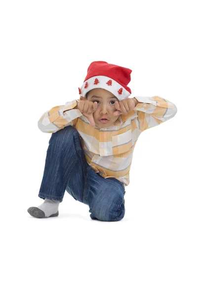 Chłopiec w kapeluszu Świętego Mikołaja — Zdjęcie stockowe