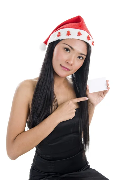 Mulher com chapéu de Papai Noel e cartão de visita em branco — Fotografia de Stock