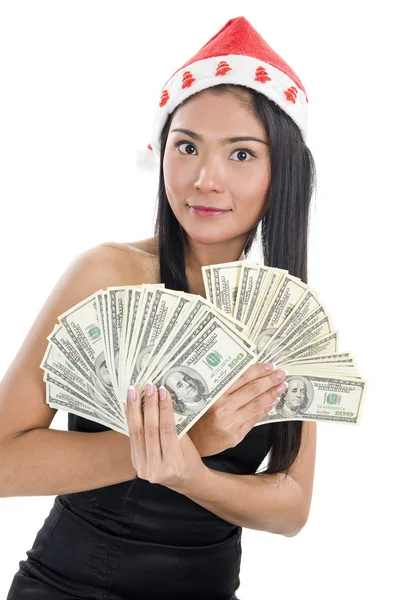 Женщина в шляпе Санты Клауса и с деньгами — стоковое фото
