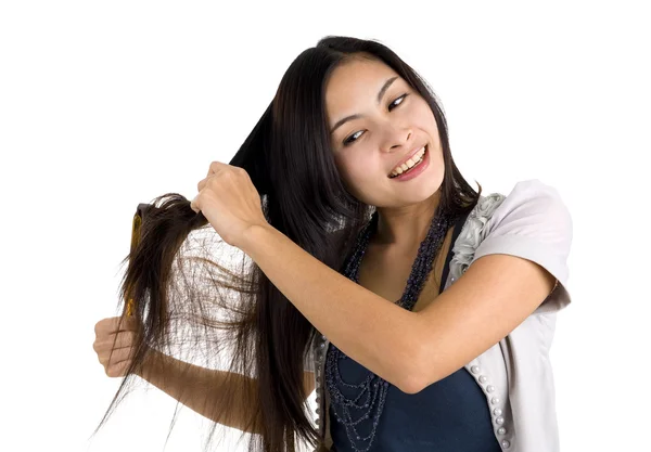 Woman brushing her hair — Stock Photo, Image