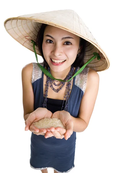 Mulher com arroz nas mãos — Fotografia de Stock