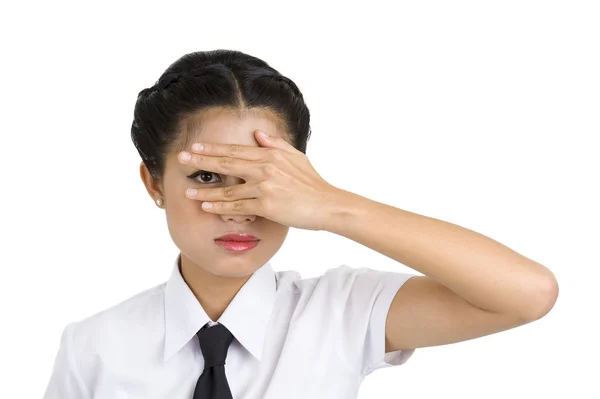 Businesswoman looking through her fingers — Stock Photo, Image