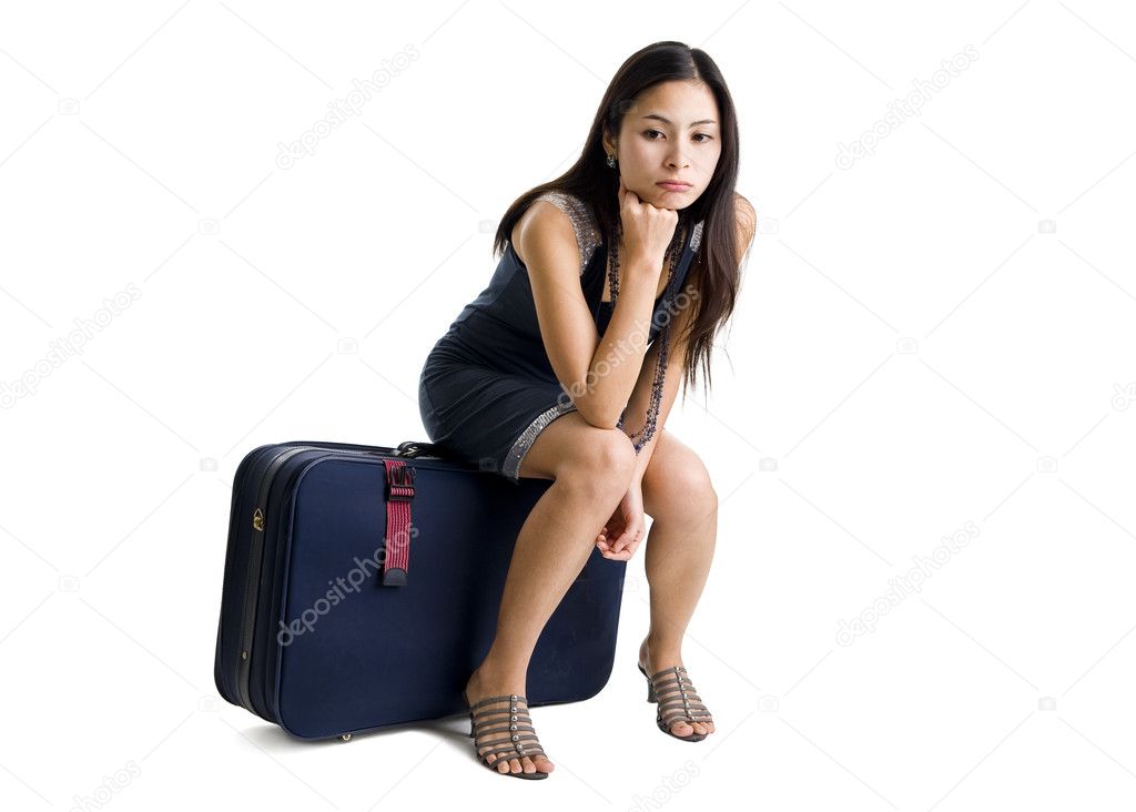 Pretty woman sitting on a bag