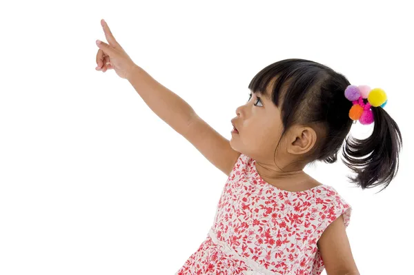 Süßes Kleines Mädchen Zeigt Auf Etwas Isoliert Auf Weißem Hintergrund — Stockfoto