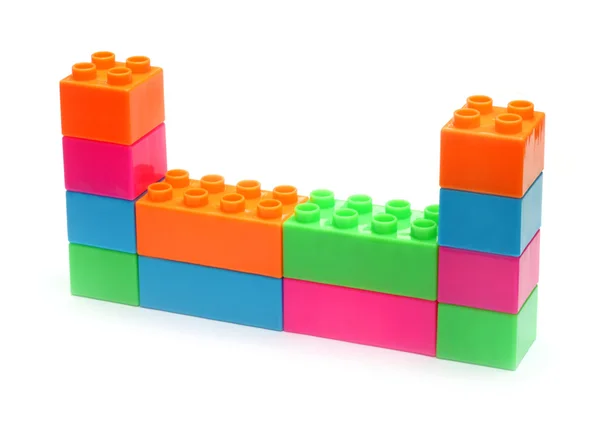 Colorido plástico juguete ladrillos pared —  Fotos de Stock