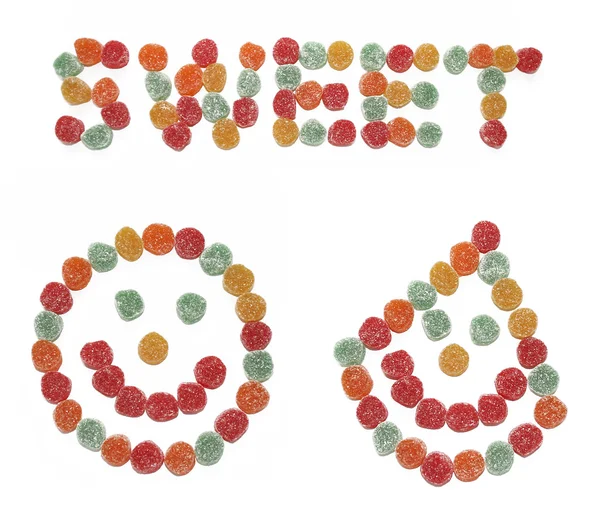 微笑的面孔和所作的水果糖的 Word 图库照片