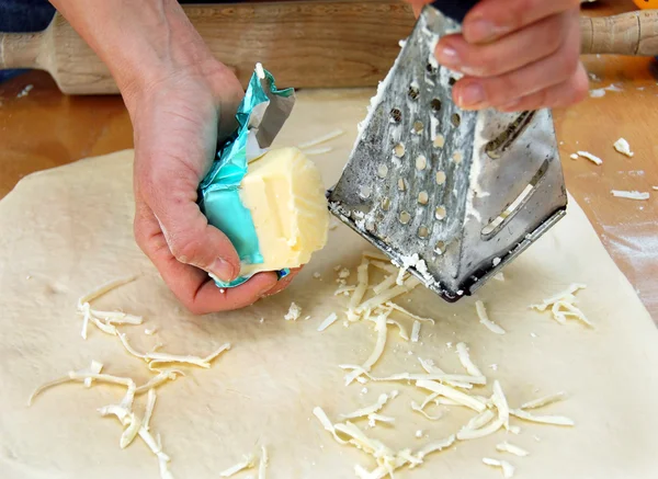 Grated butter on dough — Stock Photo, Image
