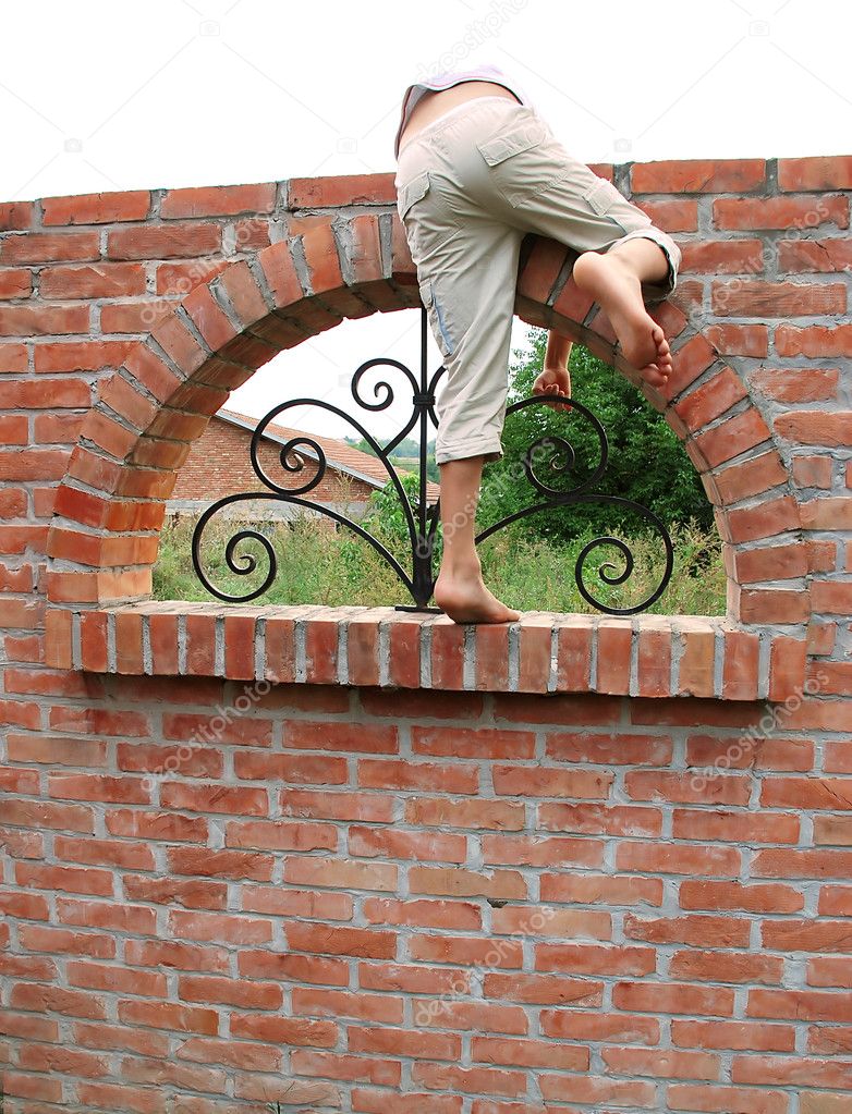 Escape over brick wall