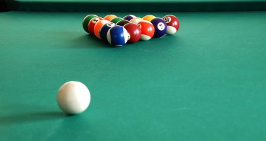 Billiards green table with balls in beginning position indoor clipart