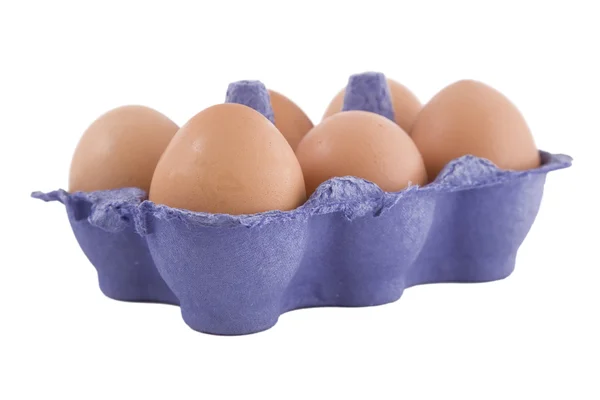 Jaja kur brązowy w opakowaniu jaj niebieski — Zdjęcie stockowe
