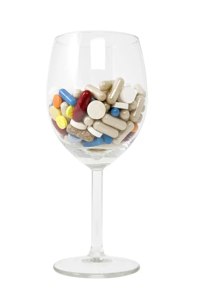 Vidro de comprimidos e cápsulas multicoloridos — Fotografia de Stock