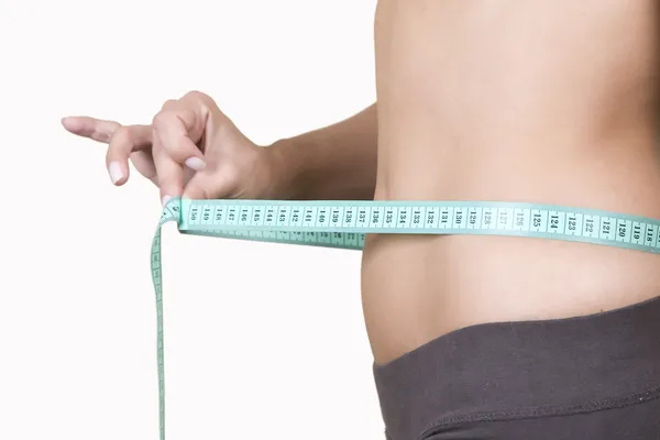 Concepto de estilo de vida saludable, parte del cuerpo de la mujer que mide la cintura — Foto de Stock