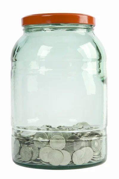 Frasco de vidro cheio de moedas — Fotografia de Stock