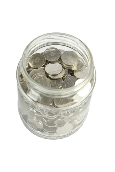 Скляна банка зі срібними монетами — стокове фото