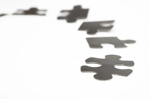 Different black puzzle — Stock Photo, Image