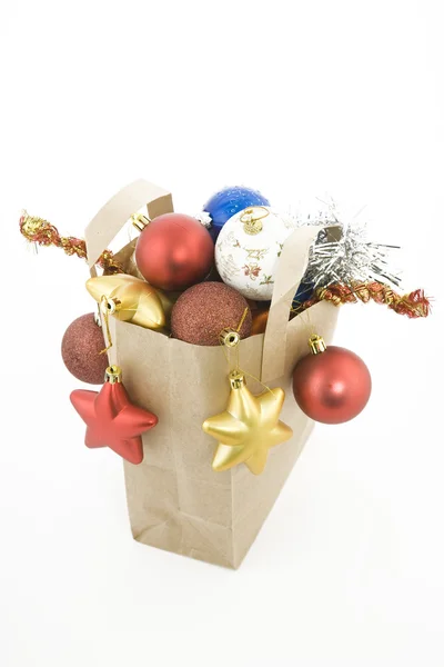 Christmas items in shopping bag — Stockfoto