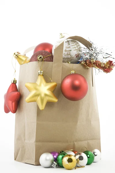 Christmas items in shopping bag — Stockfoto