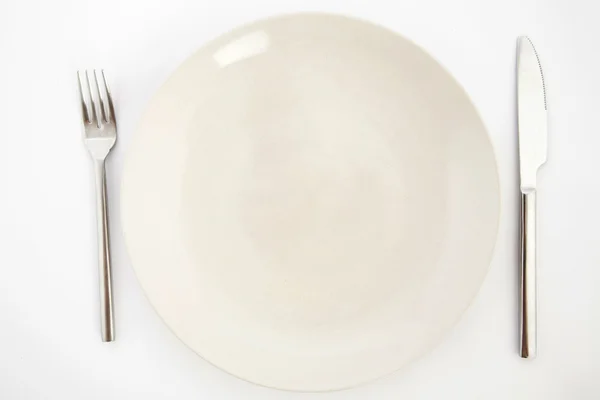 Knife, white plate and fork — Stock Photo, Image