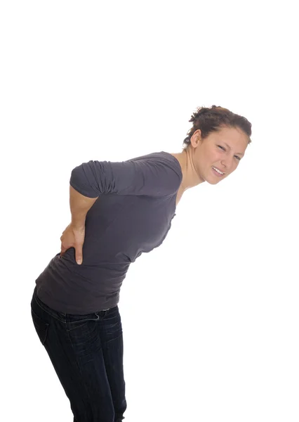 Mujer joven tiene dolor de espalda —  Fotos de Stock