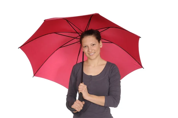 Mujer joven con paraguas rojo —  Fotos de Stock