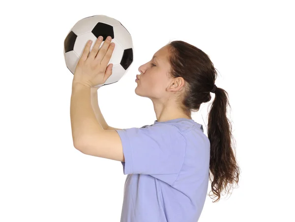 Young woman kissing a soccer ball — Stock Photo, Image