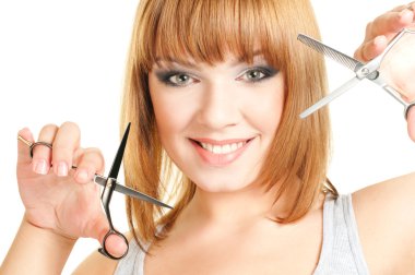 Attractive girl with scissors