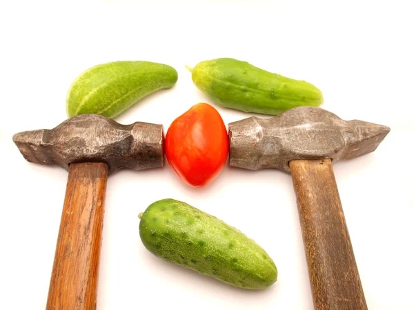 Vegetables and hammers — Stock Photo, Image