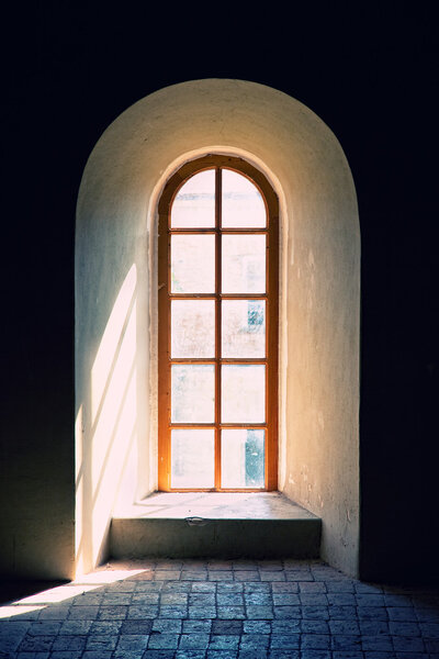 Old ancient window with tiled floor photo