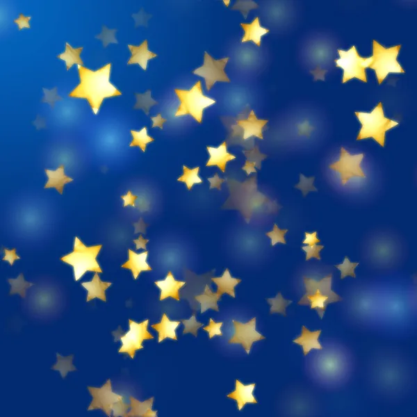 Estrelas douradas em azul — Fotografia de Stock