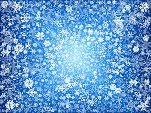 Белые снежинки в голубом — стоковое фото