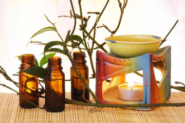 Oil Bowl Burner and Bottles Aromatherapy Still Life clipart