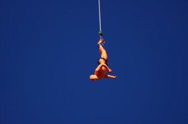 Orange Bungee Jumper At The Rat Race Urban Adventure Event In The City Of L clipart