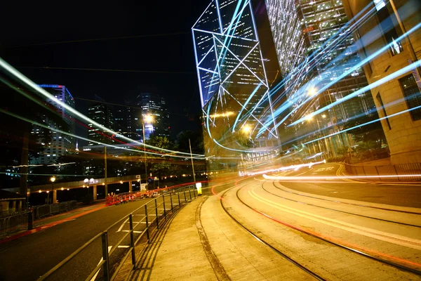 Light trails on the modern building background — Stock Photo, Image