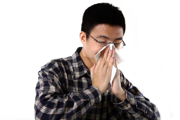 stock image man blowing his nose close up